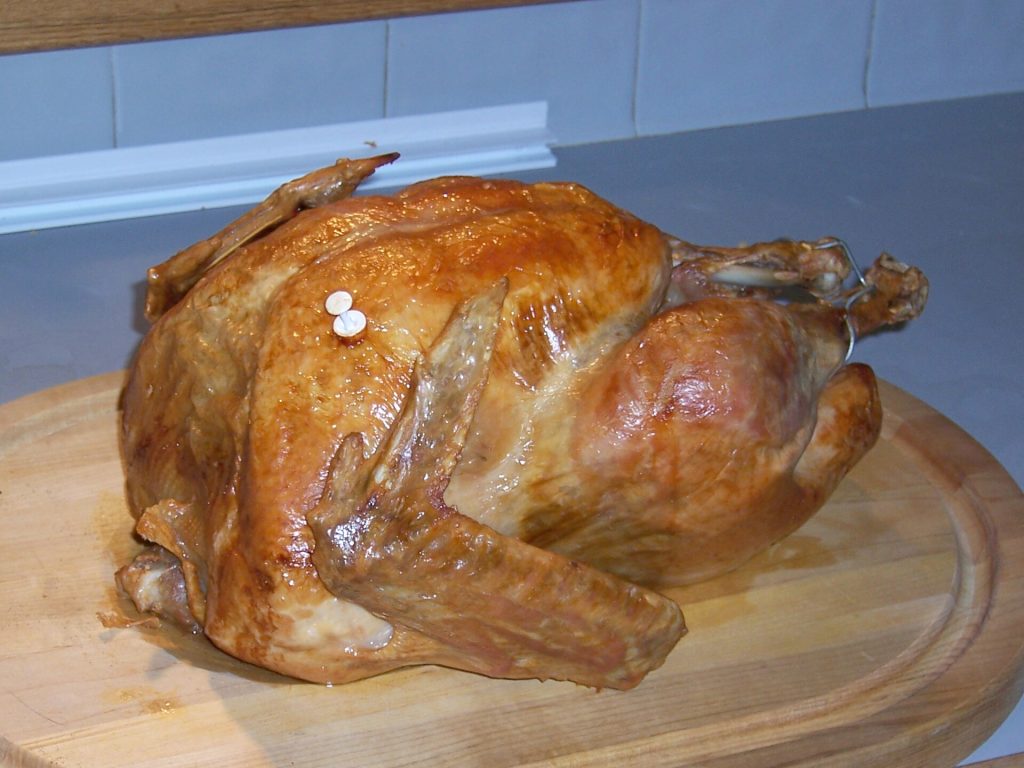 A golden roast turkey on a serving platter