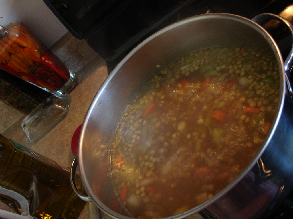 Pot of lentil and vegetable soup on the stove