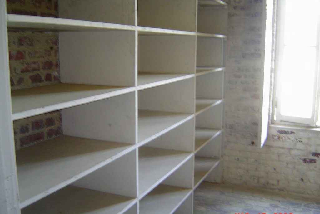 Pantry shelves with jars and dry goods