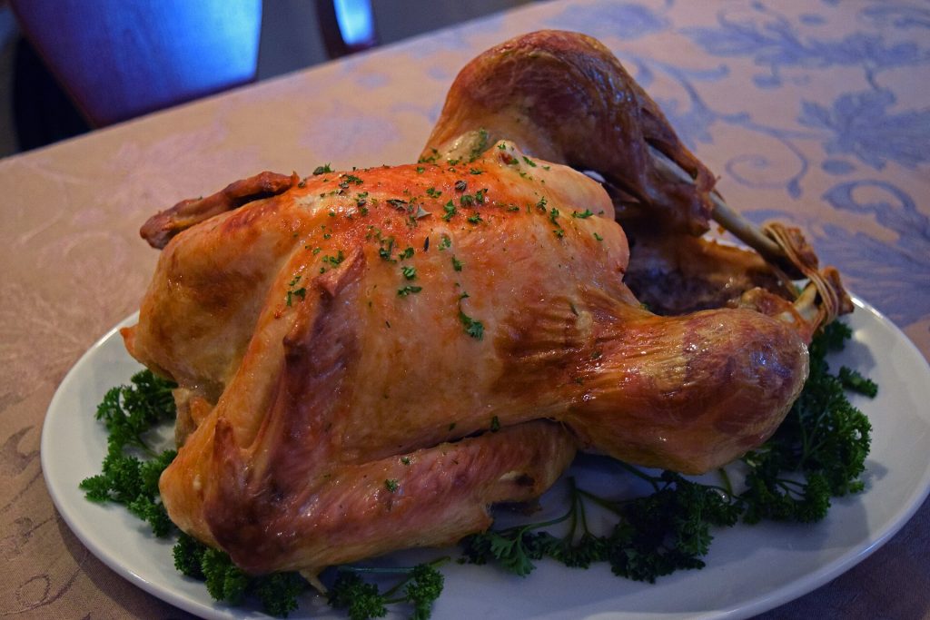 A golden roast turkey on a serving platter