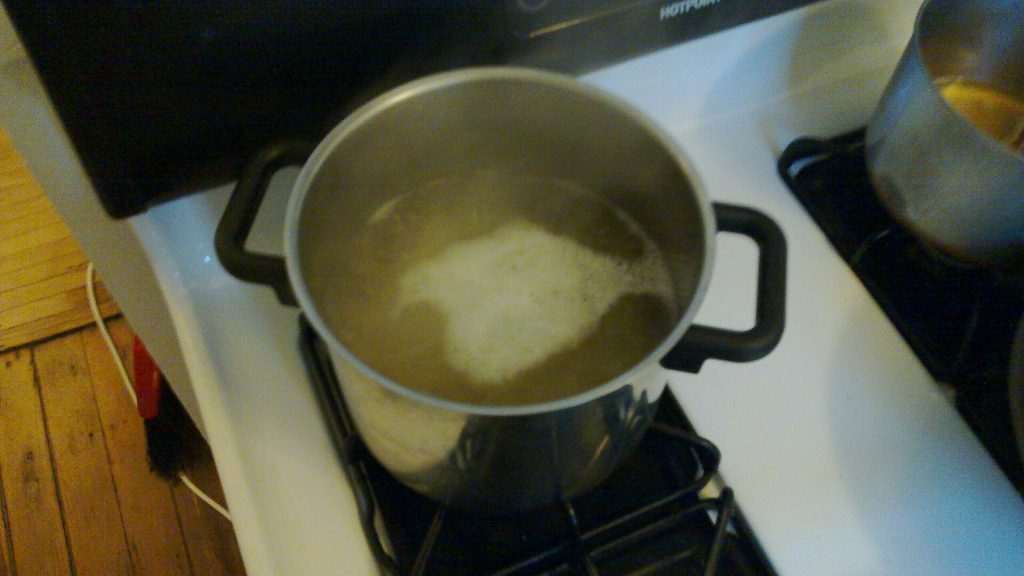 Pasta cooking in a large pot of boiling water