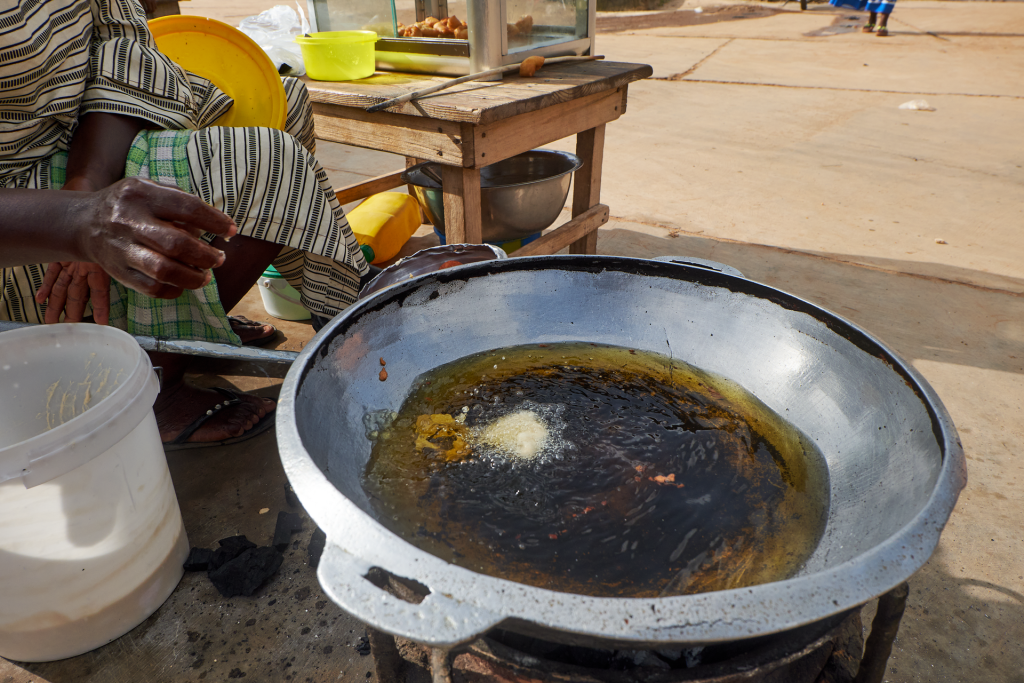 Oil heating in a frying pan on a stovetop